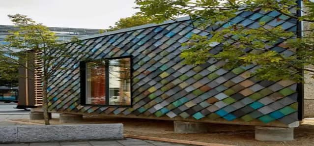 The Circle House façade with upcycled plastic shingles