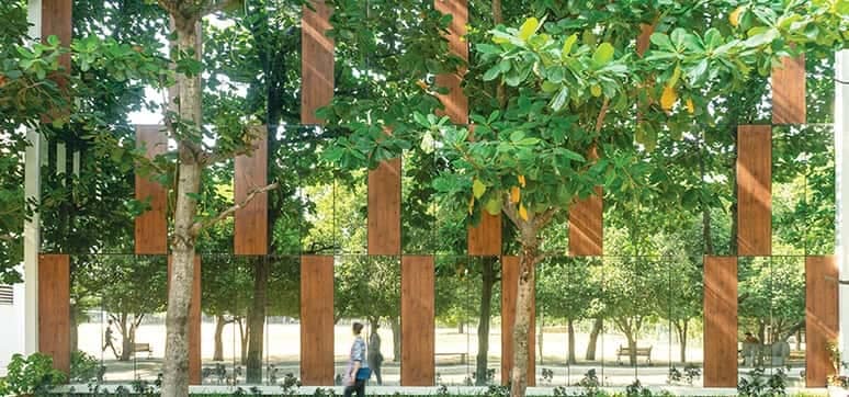 Facade Detailing with solar rated mirror glass interspersed with wooden HPL sheets