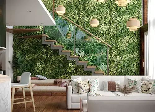 Modern living room with stairs, green wall, and hanging lamps