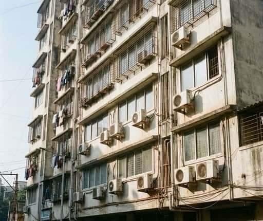 A typical Indian residential high-rise façade. Beyond the glazing, every AC unit, exhaust opening, and service penetration represents a potential acoustic weak point